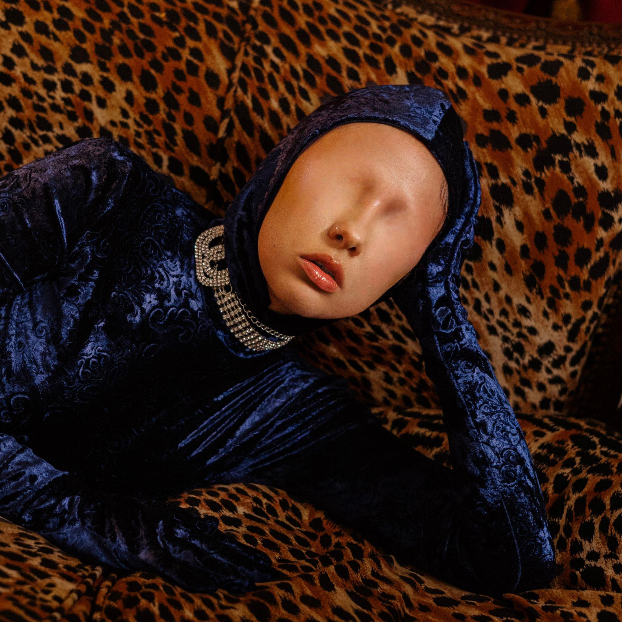 Performer wearing blue mask