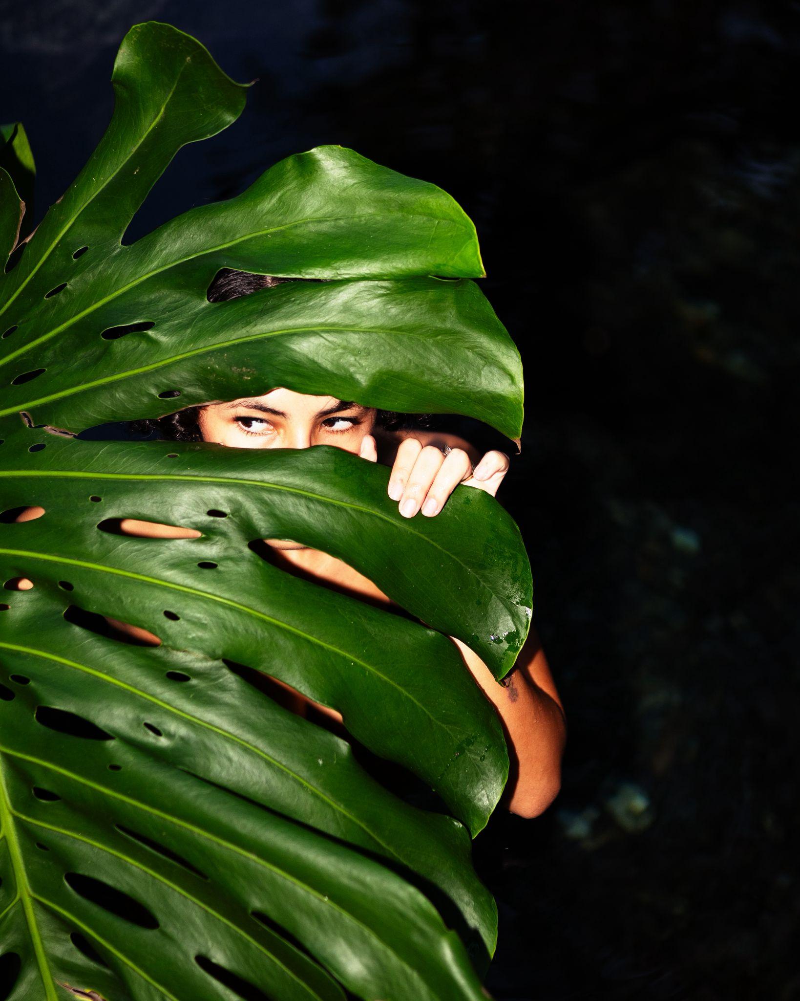Creative portrait hidden in leaves